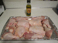 baking sheet with raw chicken on it